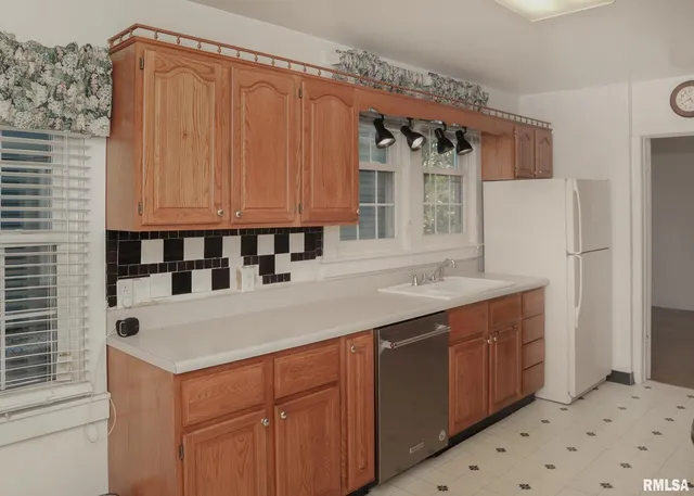 a kitchen with a sink and cabinets
