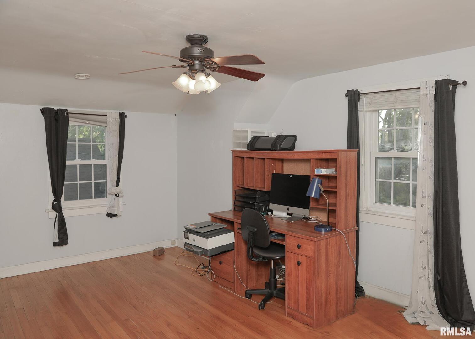421 10th Street, Unit A Silvis, IL 61282 - Photo 25 of 37 a view of workspace with wooden floor windows