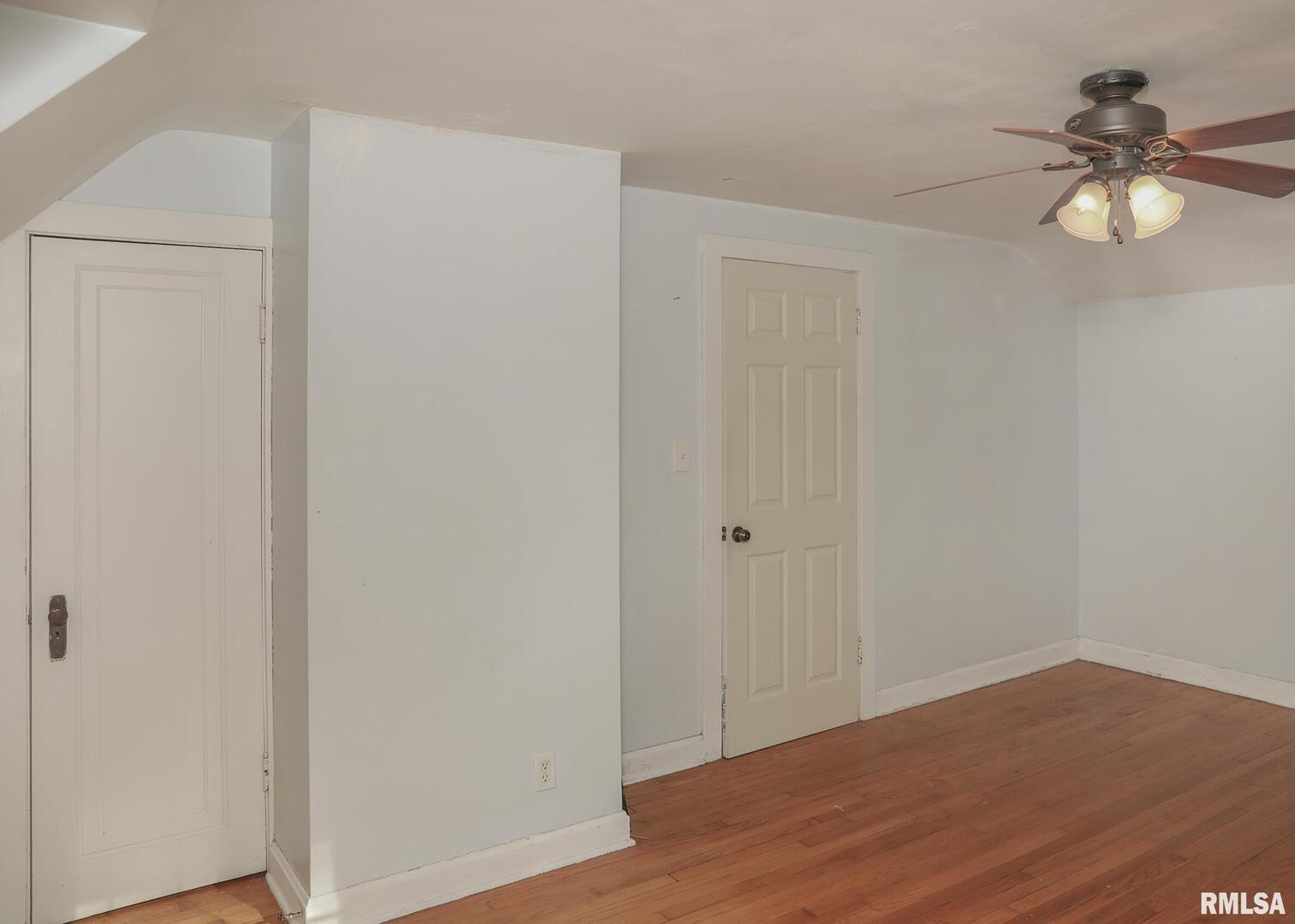 421 10th Street, Unit A Silvis, IL 61282 - Photo 26 of 37 a view of empty room with wooden floor