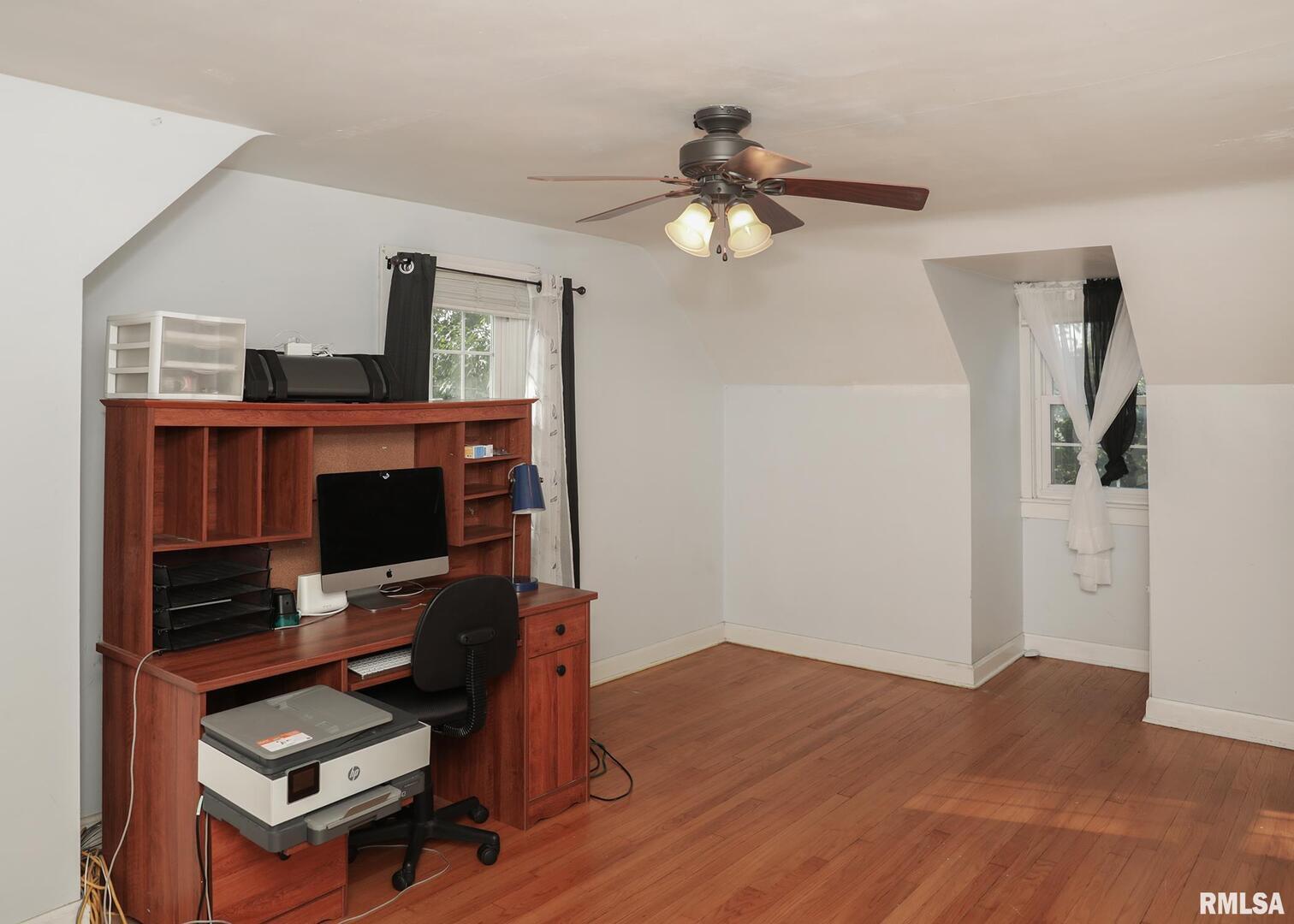 421 10th Street, Unit A Silvis, IL 61282 - Photo 28 of 37 a living room with furniture and a flat screen tv