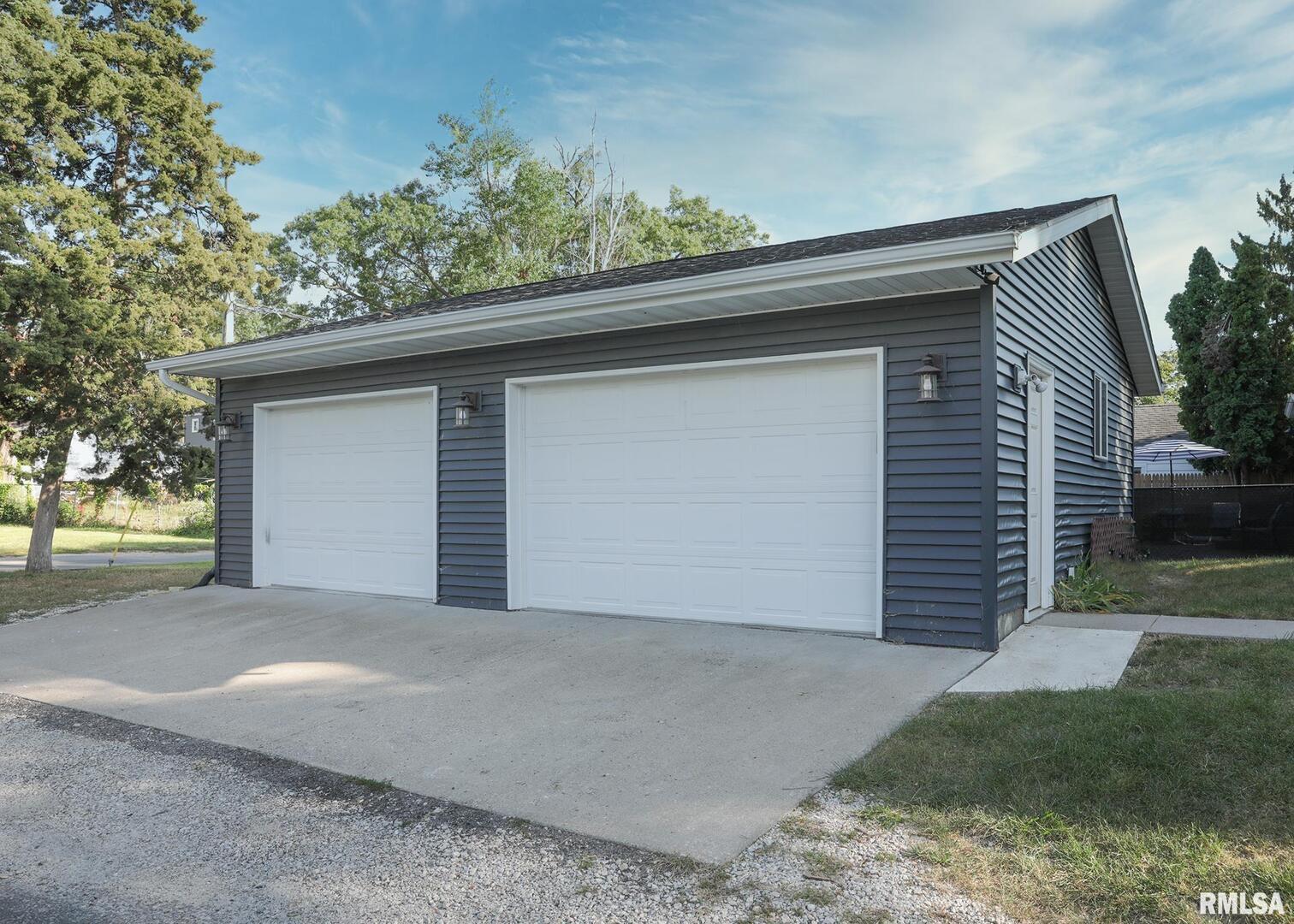 421 10th Street, Unit A Silvis, IL 61282 - Photo 3 of 37 a small white house with a outdoor space