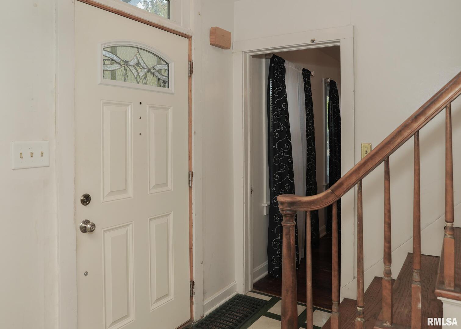 421 10th Street, Unit A Silvis, IL 61282 - Photo 4 of 37 a view of front door with wooden floor