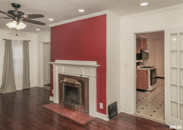a view of a livingroom with furniture and a fireplace