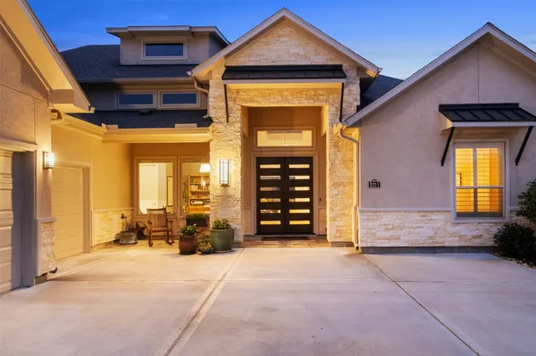 a front view of a house with a large window