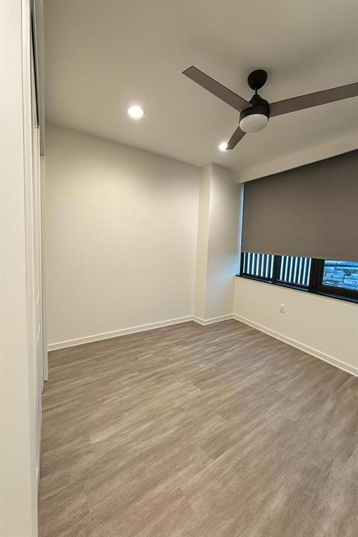 1200 Main Street, Unit 902 Dallas, TX 75202 - Photo 12 of 13 an empty room with windows