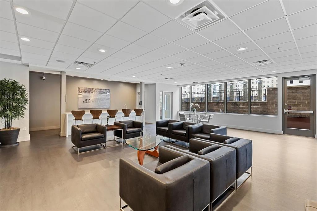 1200 Main Street, Unit 902 Dallas, TX 75202 - Photo 5 of 13 a living room with furniture and a large window