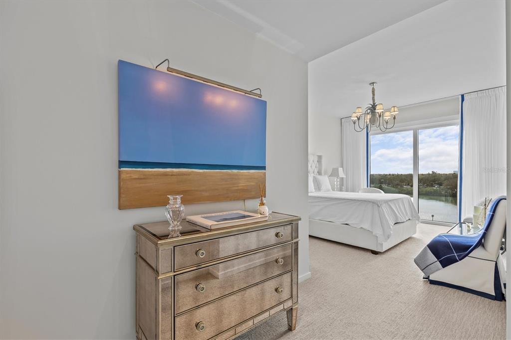 1020 Sunset Point Road, Unit 510 Clearwater, FL 33755 - Photo 12 of 44 a living room with furniture and a flat screen tv