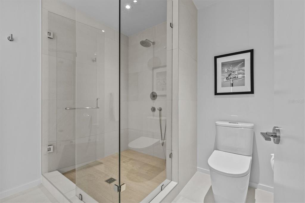 1020 Sunset Point Road, Unit 510 Clearwater, FL 33755 - Photo 17 of 44 a bathroom with a toilet and a shower