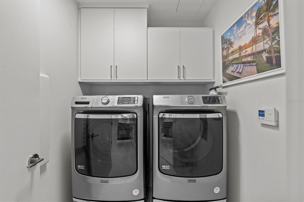 1020 Sunset Point Road, Unit 510 Clearwater, FL 33755 - Photo 23 of 44 a utility room with dryer and washer
