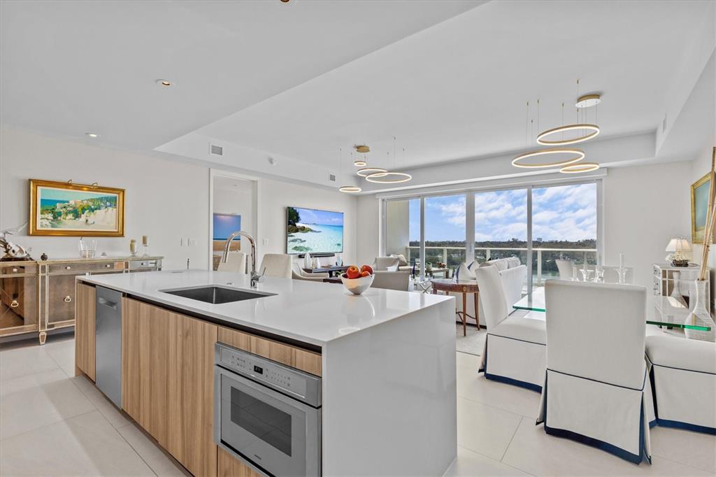 1020 Sunset Point Road, Unit 510 Clearwater, FL 33755 - Photo 9 of 44 a kitchen with counter top space a sink cabinets and appliances