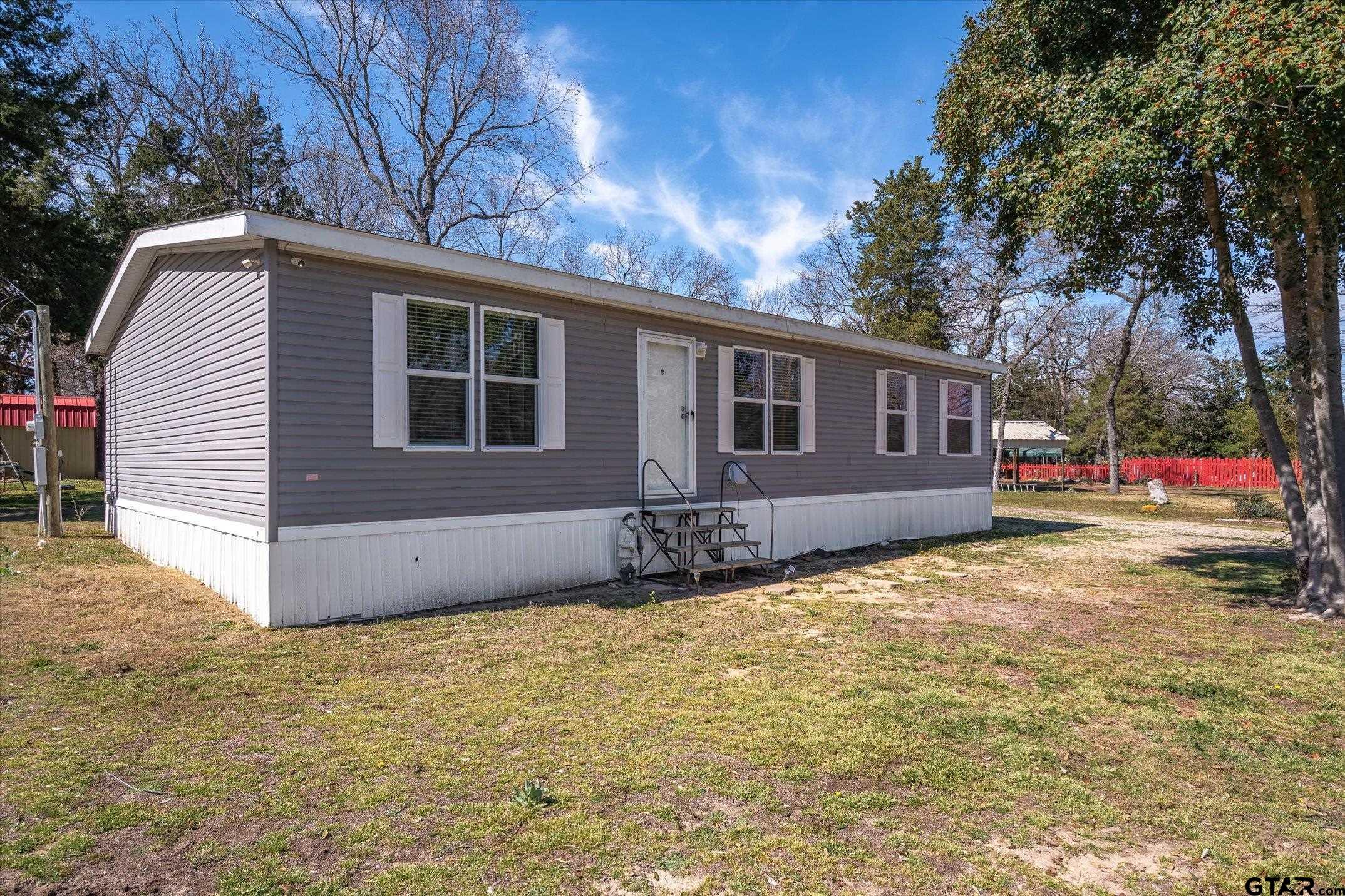 129 Elm Drive Murchison, TX 75778 - Photo 25 of 34 a view of a house with a yard