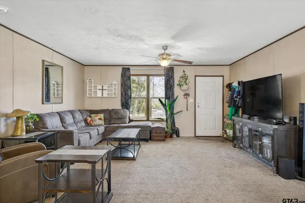 a view of a livingroom with furniture window and wooden floor