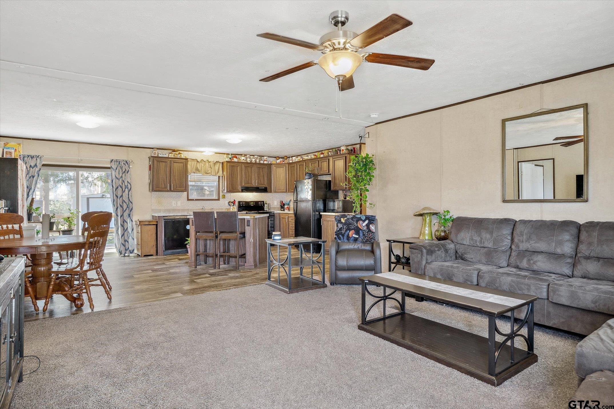 129 Elm Drive Murchison, TX 75778 - Photo 7 of 34 a living room with furniture and a large window