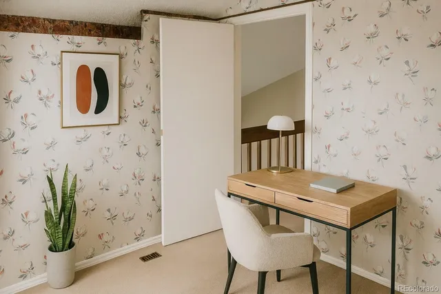 a dining room with furniture and potted plant
