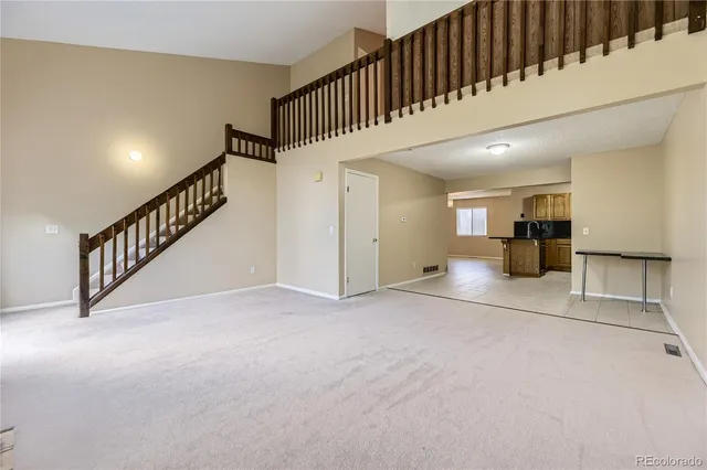 a view of a hallway with seating area