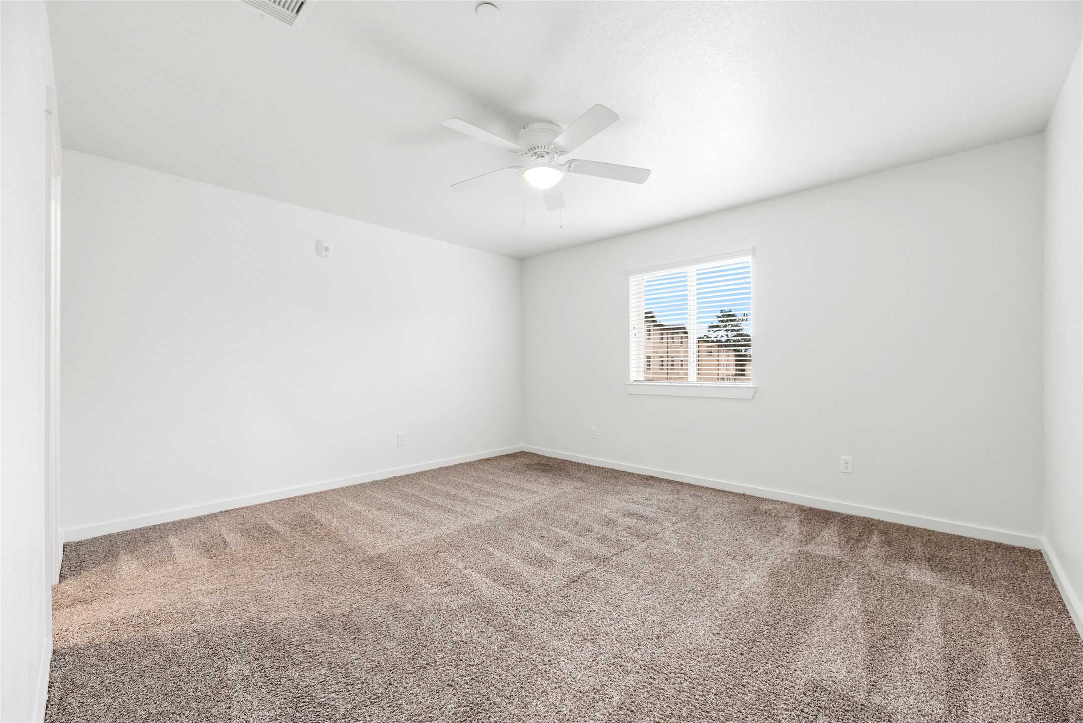 12603 Telge Road, Unit 1EH Cypress, TX 77429 - Photo 7 of 19 Second floor primary bedroom with an en-suite bathroom.