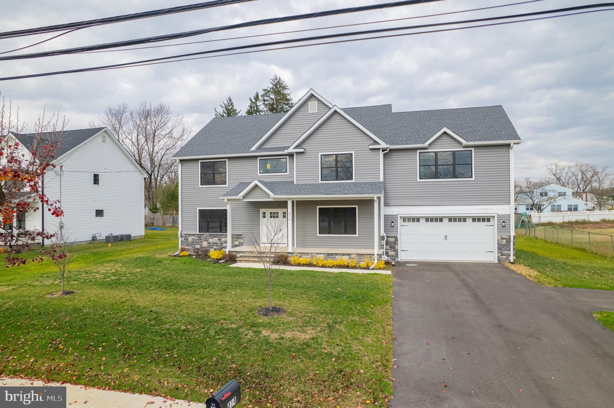 414 Flock Road Hamilton, NJ 08619 - Photo 13 of 60 a front view of a house with a yard