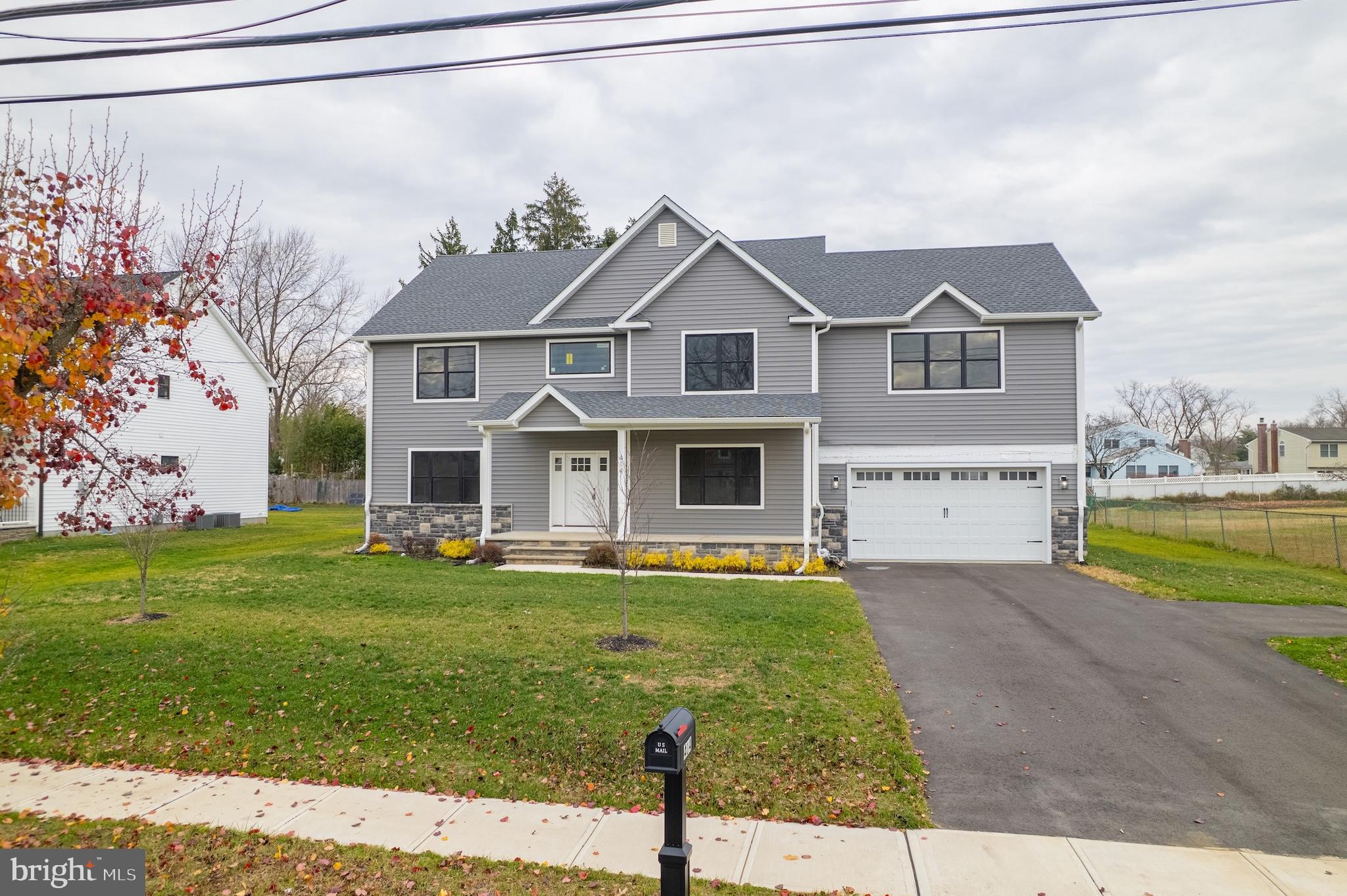 414 Flock Road Hamilton, NJ 08619 - Photo 3 of 60 a front view of a house with a yard