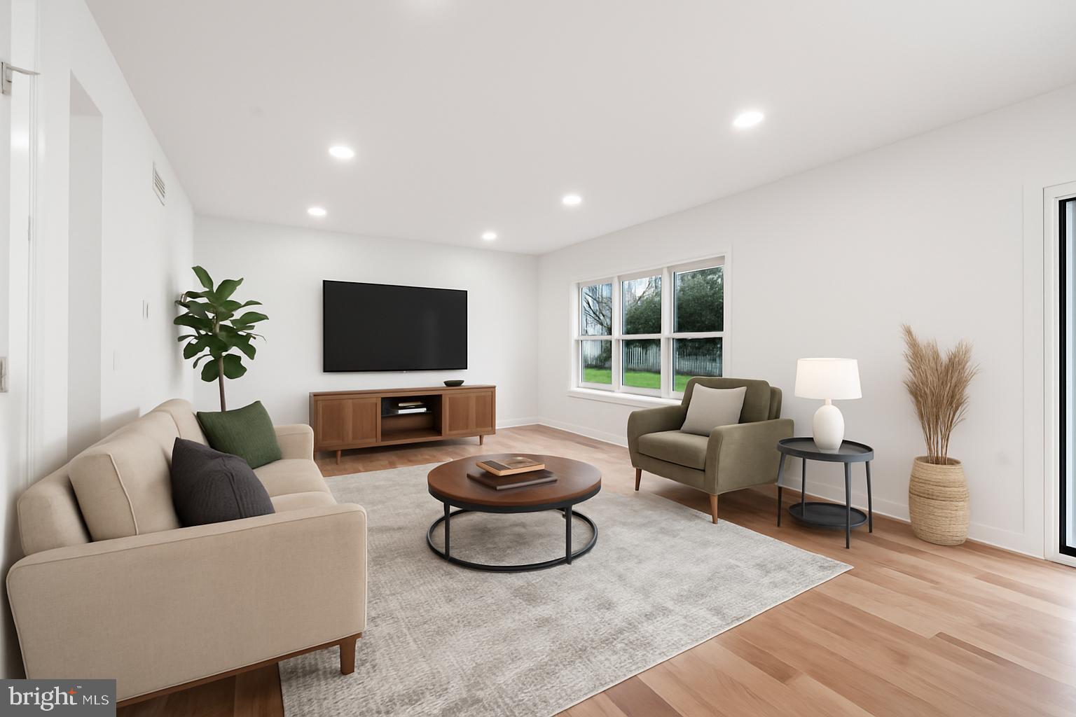 414 Flock Road Hamilton, NJ 08619 - Photo 32 of 60 a living room with furniture and a flat screen tv