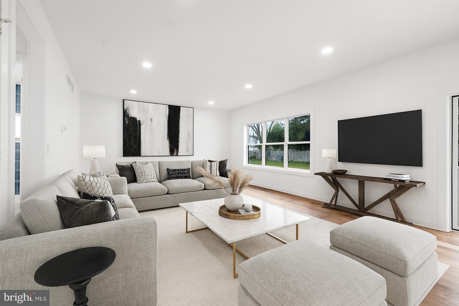 414 Flock Road Hamilton, NJ 08619 - Photo 33 of 60 a living room with furniture and a flat screen tv