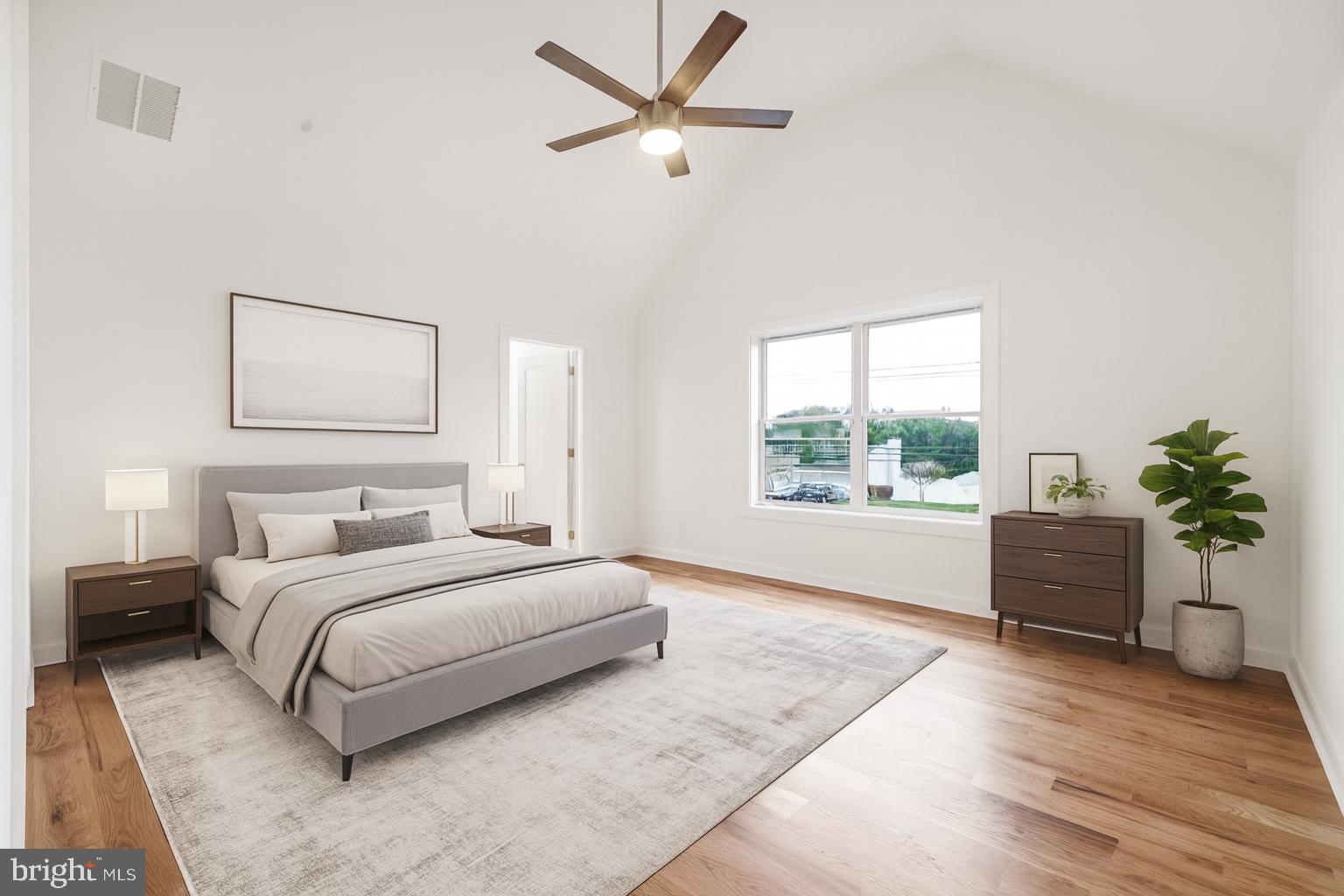 414 Flock Road Hamilton, NJ 08619 - Photo 34 of 60 a spacious bedroom with a large bed and a large window