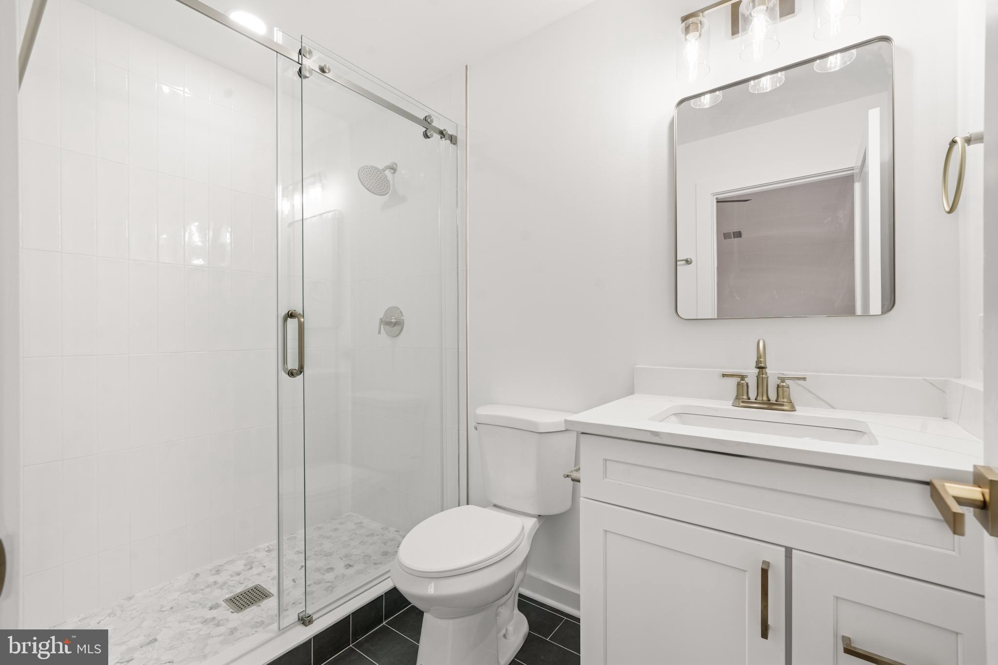 414 Flock Road Hamilton, NJ 08619 - Photo 43 of 60 a bathroom with a sink toilet and shower