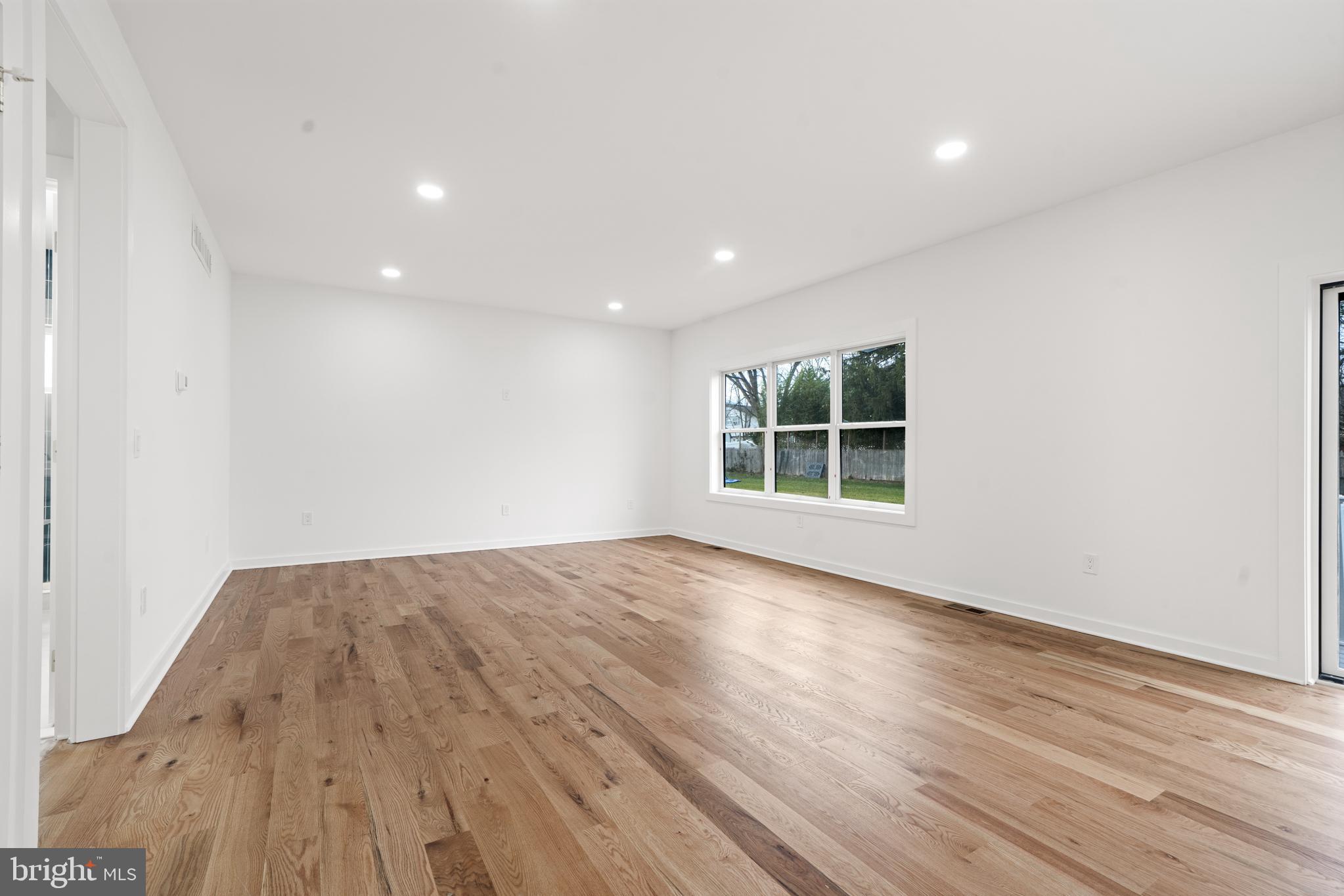 414 Flock Road Hamilton, NJ 08619 - Photo 44 of 60 an empty room with wooden floor and windows