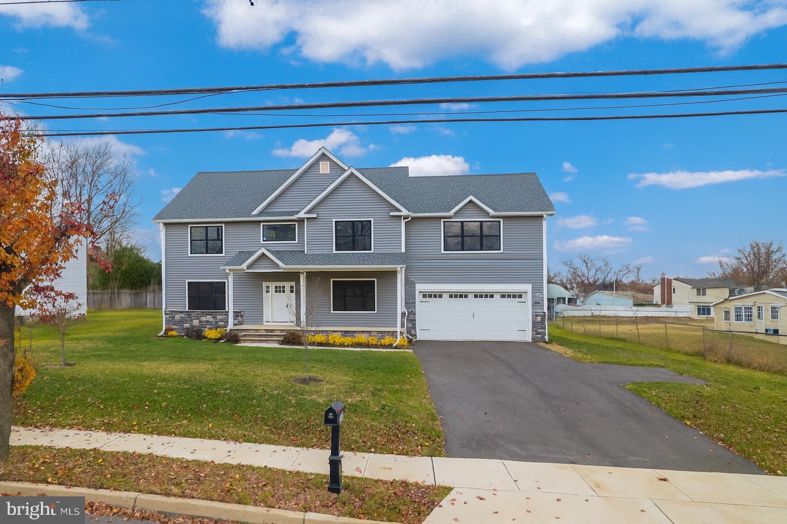 414 Flock Road Hamilton, NJ 08619 - Photo 5 of 60 a front view of a house with garden