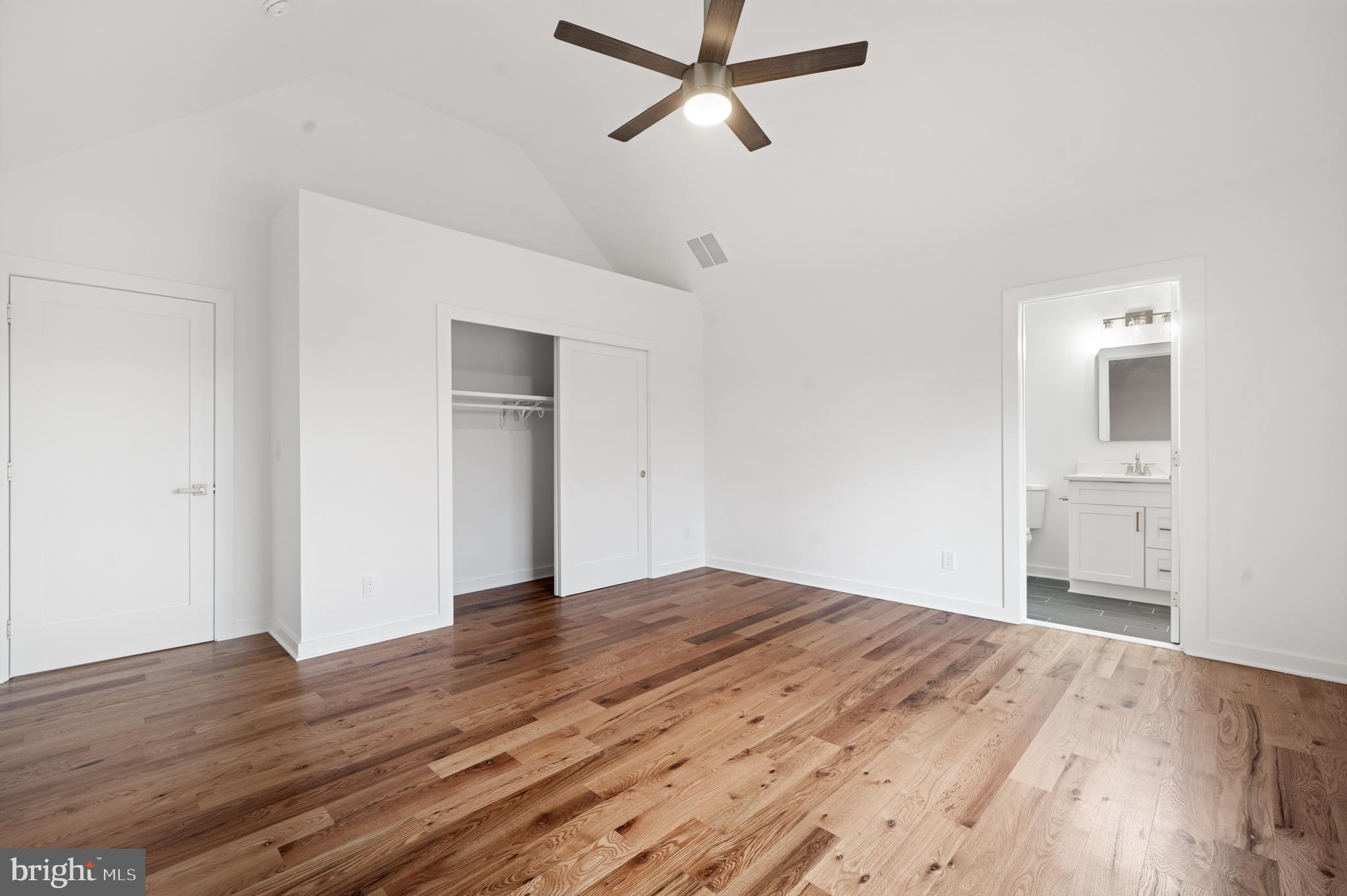 414 Flock Road Hamilton, NJ 08619 - Photo 51 of 60 a view of a room with wooden floor and a ceiling fan