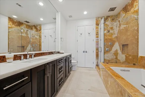 a bathroom with a bathtub and a shower