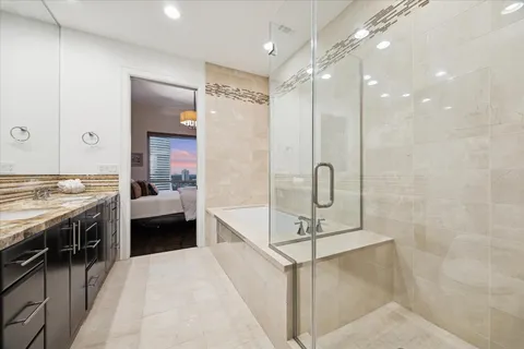 a view of a storage and utility room with washer and dryer