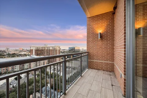 a view of a balcony with city view