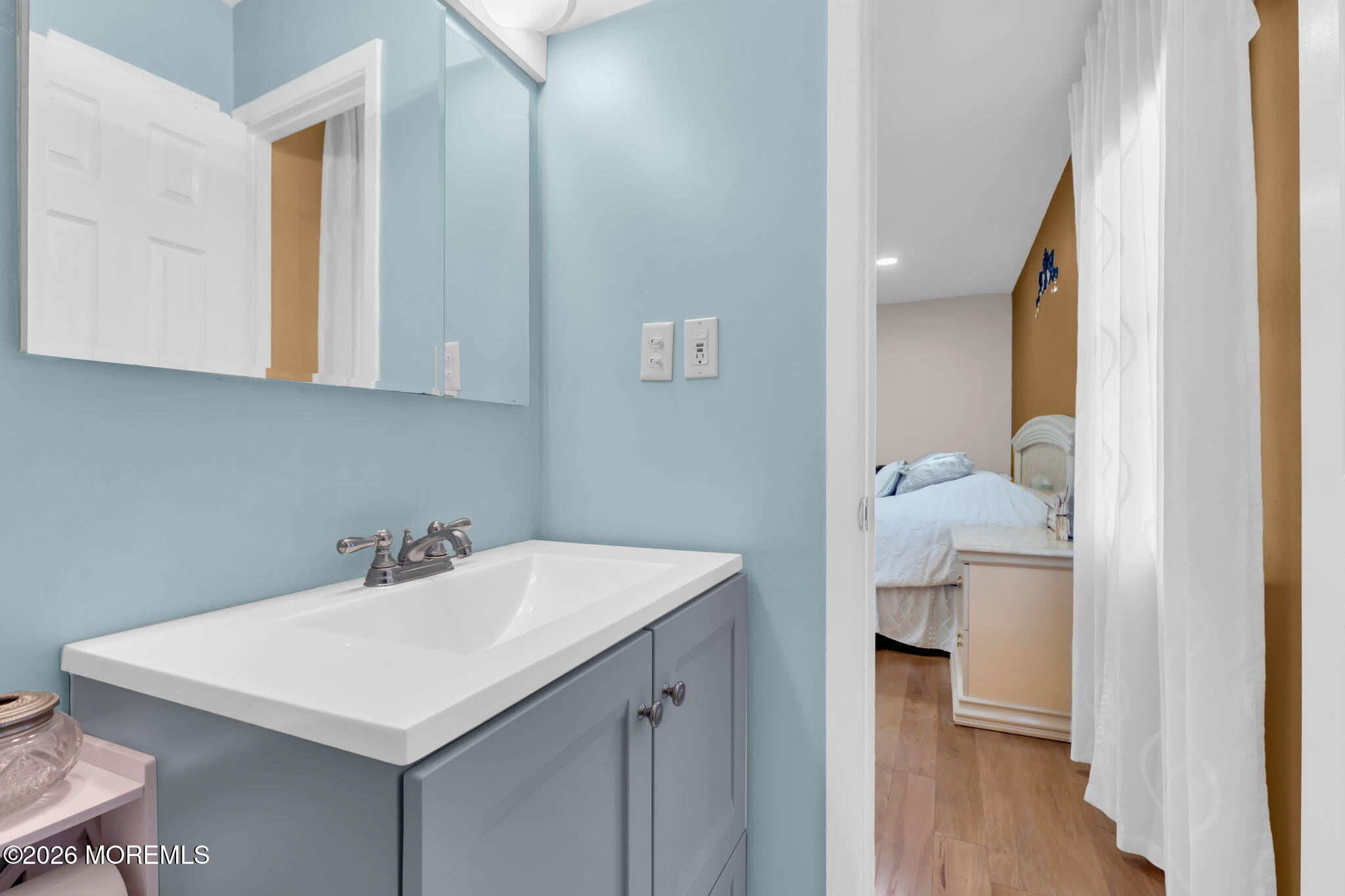 101 Andover Lane Matawan, NJ 07747 - Photo 40 of 51 a bathroom with a sink a toilet and a mirror