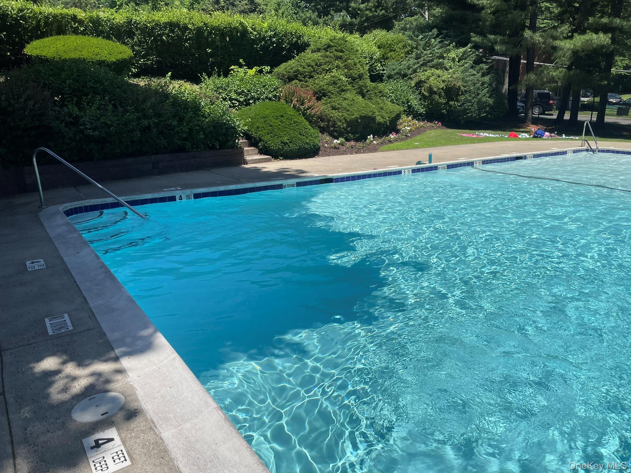 180 Pinewood Road, Unit 11 Hartsdale, NY 10530 - Photo 10 of 13 a view of yard with swimming pool and outdoor seating