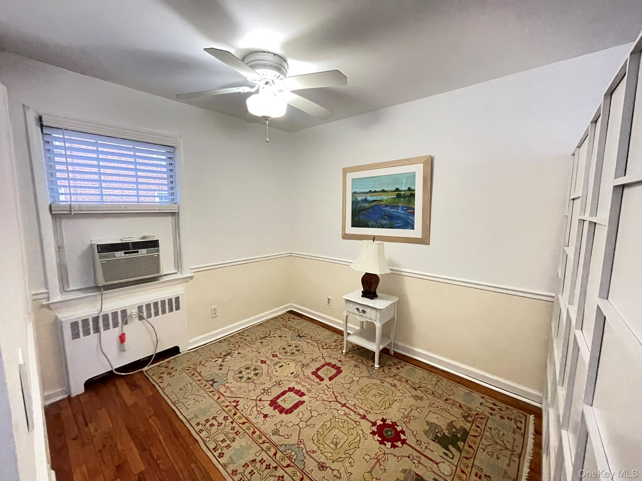 180 Pinewood Road, Unit 11 Hartsdale, NY 10530 - Photo 7 of 13 a bedroom with a bed and a window