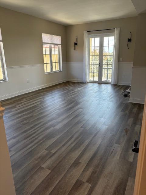 1200 Town Center Drive, Unit 427 Jupiter, FL 33458 - Photo 10 of 33 wooden floor in an empty room with a window