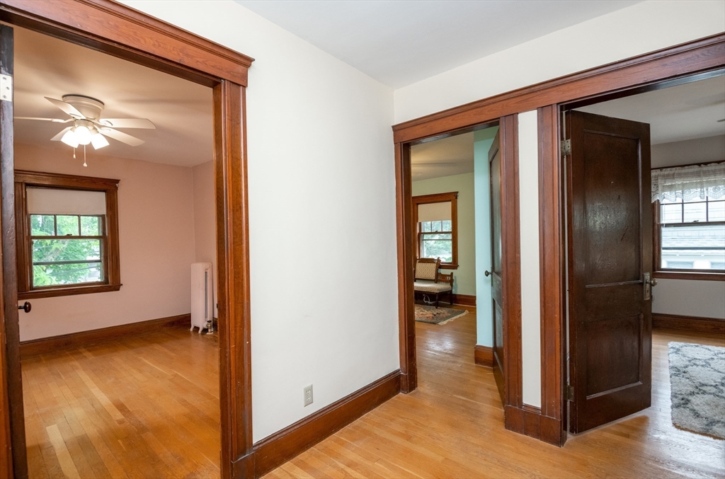 47 Ronald Road Arlington, MA 02474 - Photo 27 of 37 a view of empty room with wooden floor and a bathroom