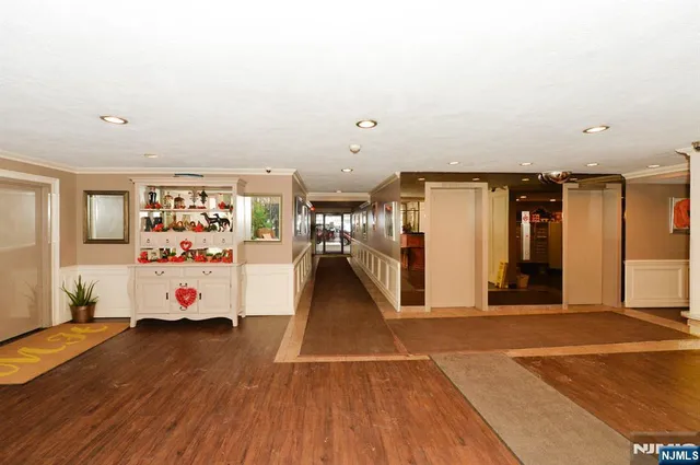 a view of a livingroom with furniture and wooden floor