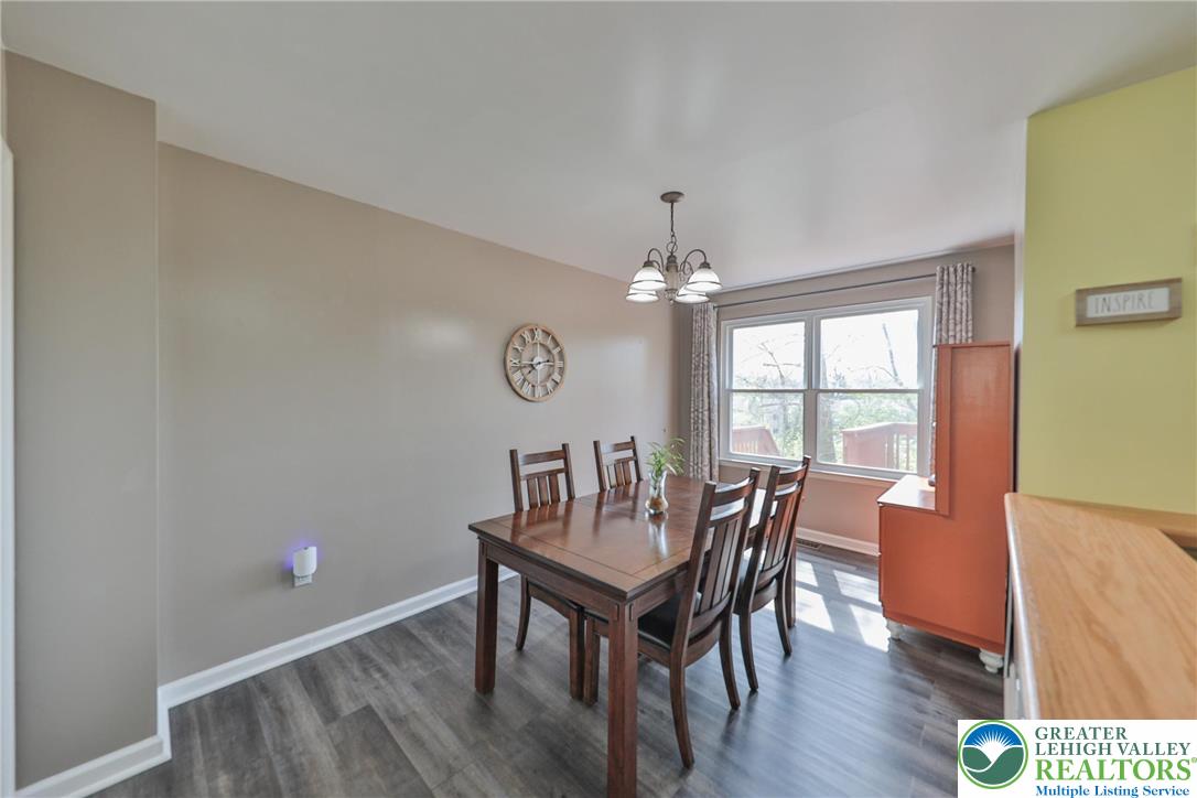 136 Cornerstone Place Whitehall, PA 18052 - Photo 15 of 39 a view of a dining room with furniture window and wooden floor