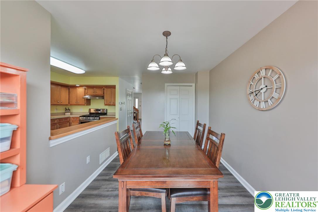 136 Cornerstone Place Whitehall, PA 18052 - Photo 18 of 39 a view of a dining room with furniture and wooden floor