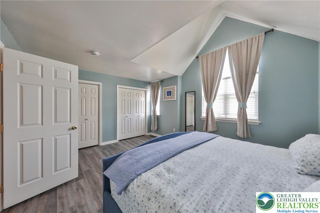 136 Cornerstone Place Whitehall, PA 18052 - Photo 30 of 39 a bedroom with a bed and wooden floor