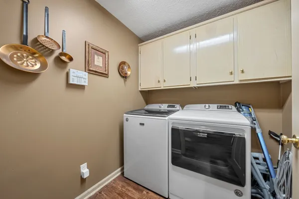 a view of storage and utility room with washer and dryer
