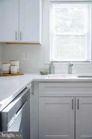 a living room with furniture or couch and a wooden floor