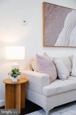 a living room with furniture fireplace and window
