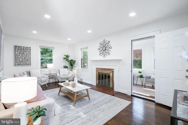 a living room with furniture or couch and a fireplace