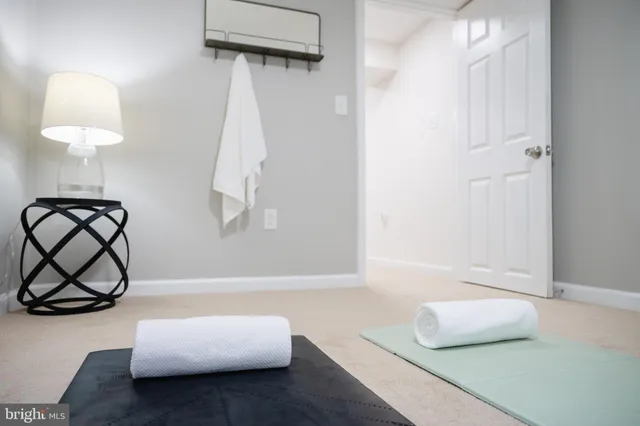 a view of an empty room and a window