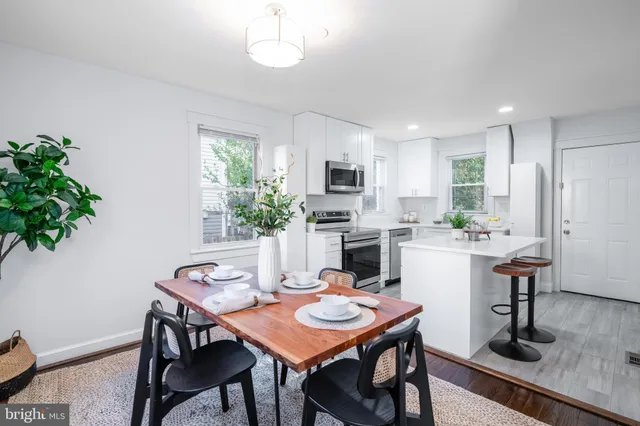 a kitchen with a table and chairs in it