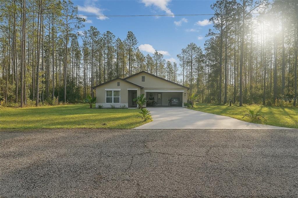 7065 North Heritage Drive Dunnellon, FL 34434 - Photo 1 of 30 a house with a trees in front of it