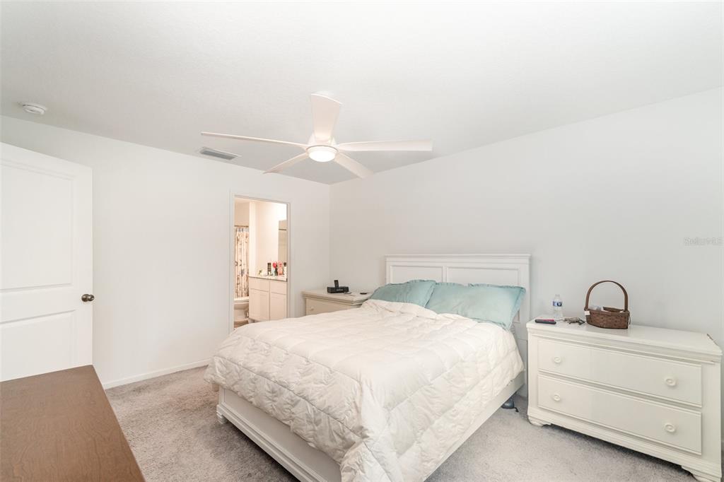 7065 North Heritage Drive Dunnellon, FL 34434 - Photo 14 of 30 a bedroom with a bed and a window