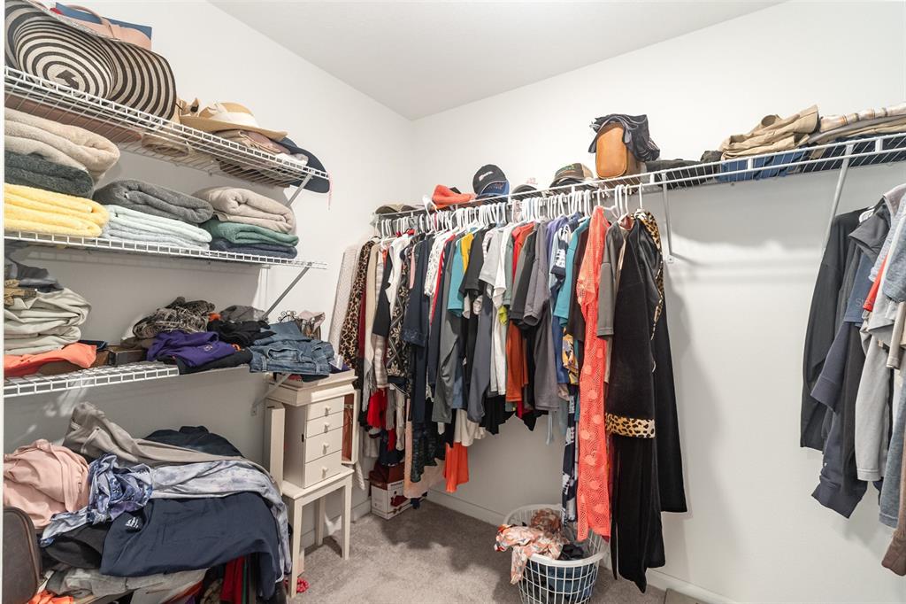 7065 North Heritage Drive Dunnellon, FL 34434 - Photo 15 of 30 a view of walk in closet with clothes and shoes